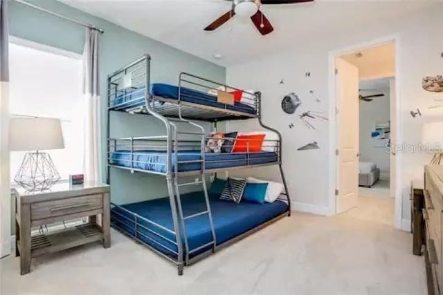 bedroom featuring ensuite bathroom and ceiling fan