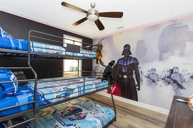 bedroom with hardwood / wood-style flooring and ceiling fan