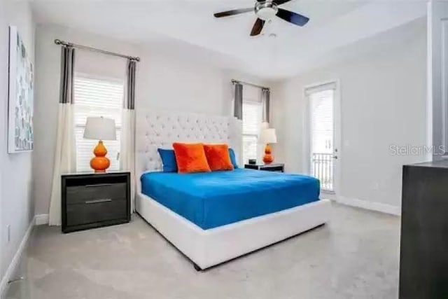 bedroom featuring ceiling fan and multiple windows