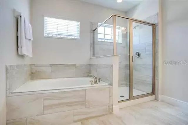 bathroom with separate shower and tub