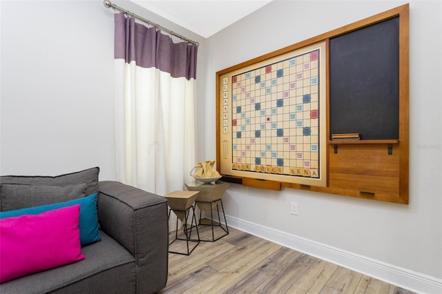 sitting room featuring hardwood / wood-style floors