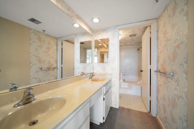 bathroom with tile patterned flooring, vanity, and separate shower and tub