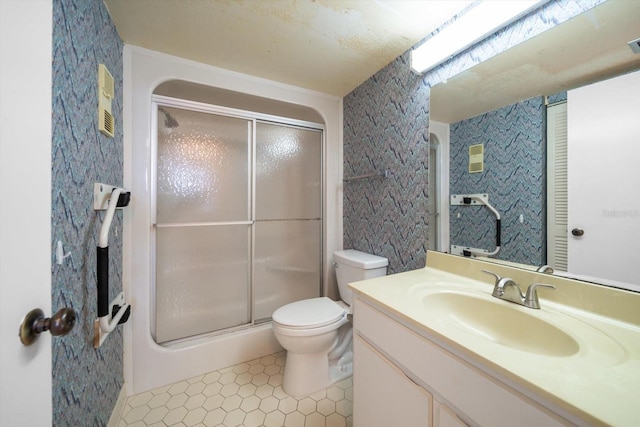 bathroom featuring vanity, toilet, and walk in shower