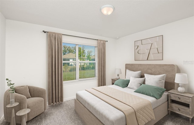 carpeted bedroom with a textured ceiling