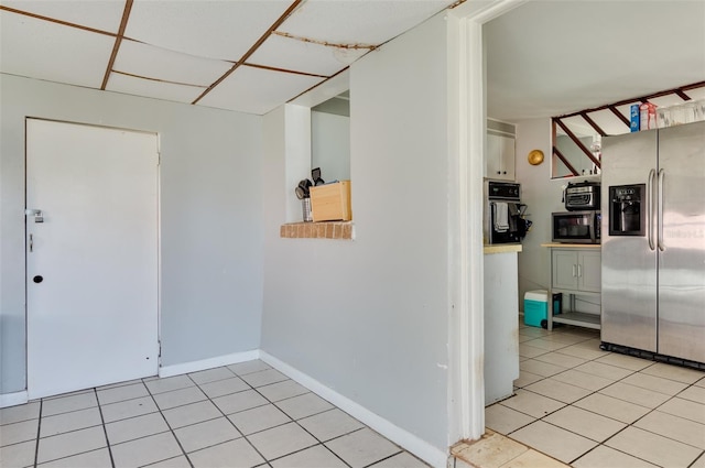 interior space with light tile patterned floors