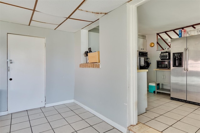 10273 109th Ave, Largo, FL 33773 - foyer with light tile patterned floors and baseboards