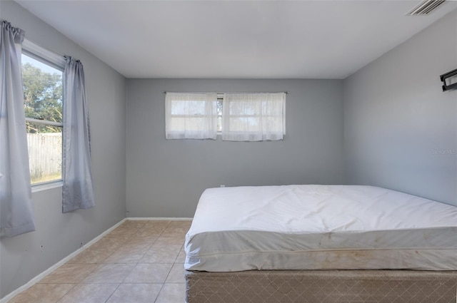 unfurnished bedroom featuring light tile patterned floors