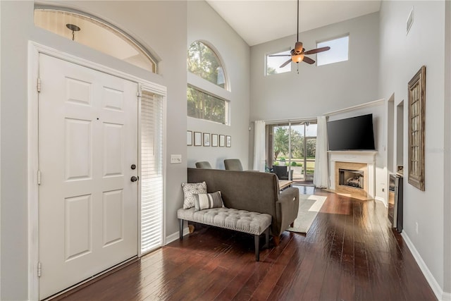 entryway featuring hardwood / wood-style floors, ceiling fan, and high vaulted ceiling