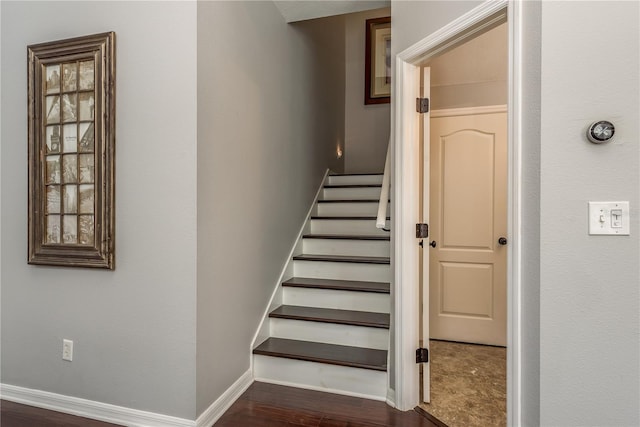 stairway featuring hardwood / wood-style floors