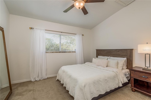 bedroom with light carpet, vaulted ceiling, and ceiling fan