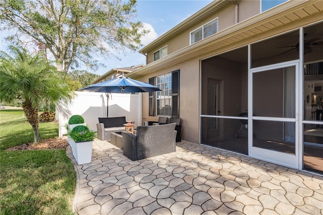 view of patio / terrace featuring outdoor lounge area and a sunroom