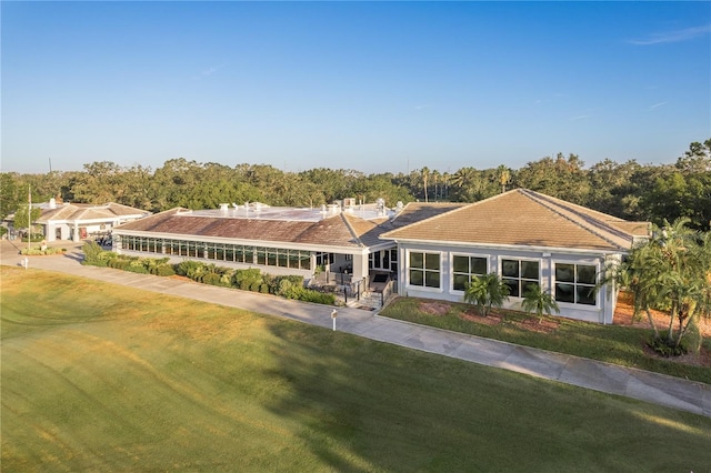 ranch-style house with a front lawn