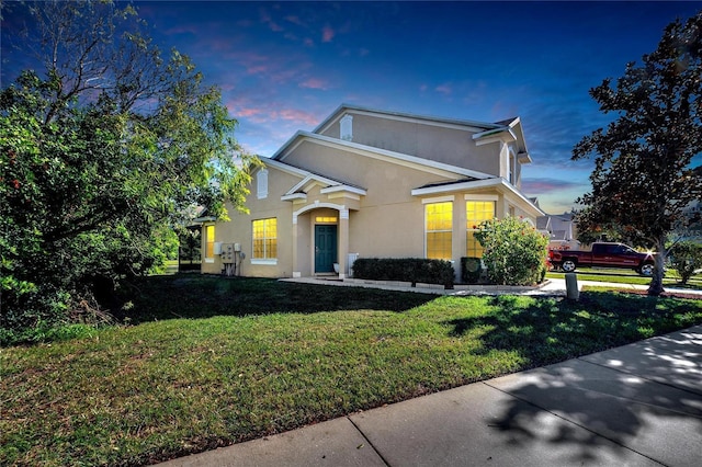 front facade with a lawn