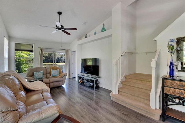 living room featuring ceiling fan, high vaulted ceiling, and wood-type flooring