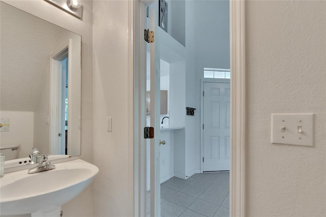 bathroom featuring tile patterned floors and sink