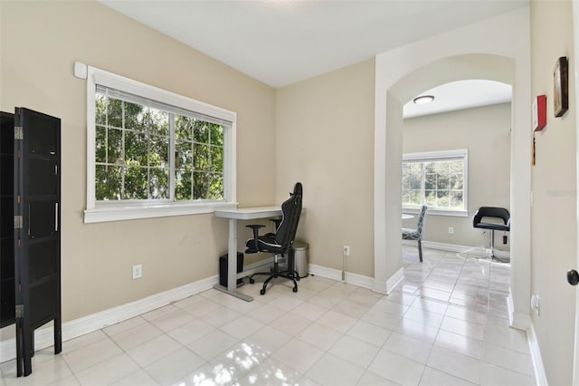 office space with light tile patterned floors