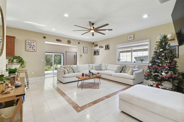 living room with ceiling fan and light tile patterned floors