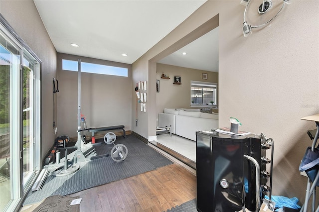 workout area featuring hardwood / wood-style flooring