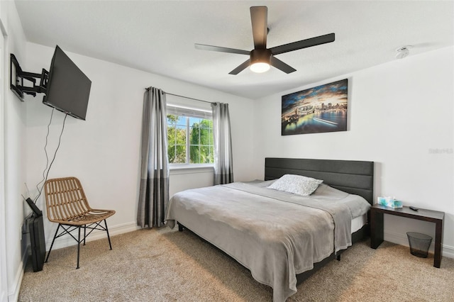 bedroom featuring light carpet and ceiling fan