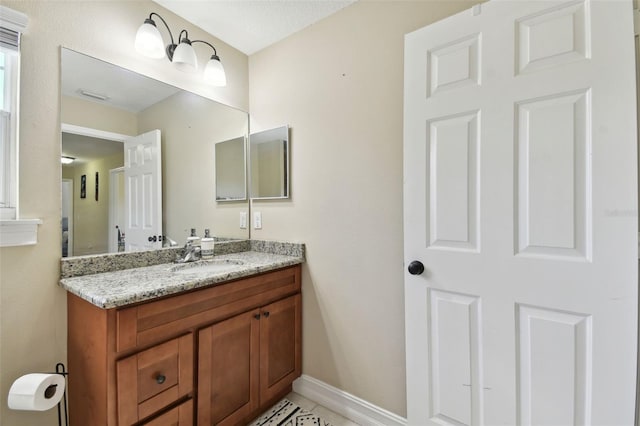 bathroom featuring vanity and a textured ceiling