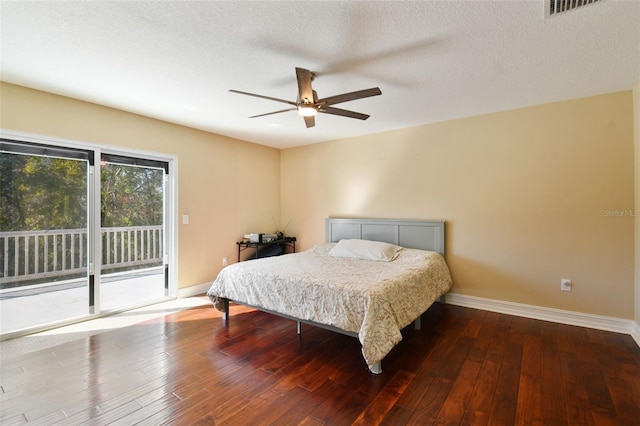 bedroom with access to exterior, ceiling fan, hardwood / wood-style floors, and a textured ceiling