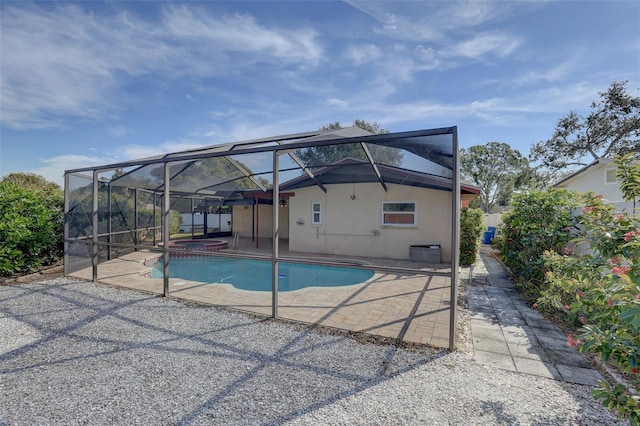 view of pool with a lanai and a patio area