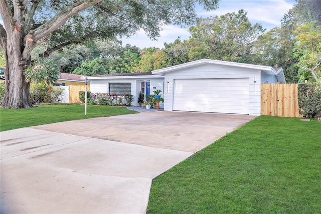 single story home with a garage and a front yard