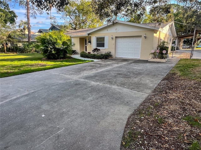 ranch-style home with a front yard and a garage