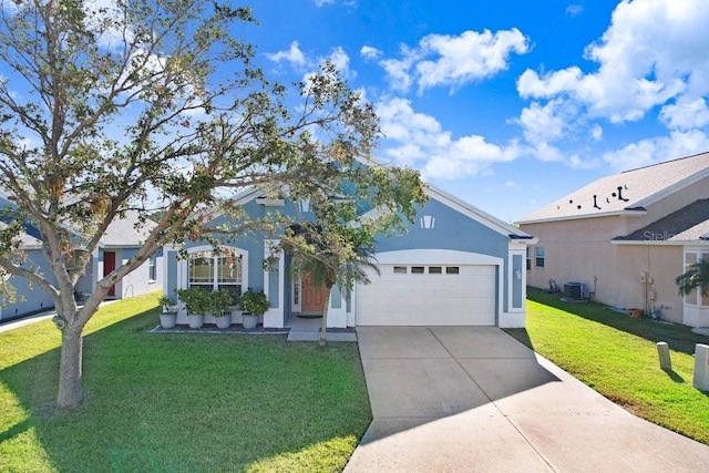 view of front of property featuring cooling unit, a front lawn, and a garage