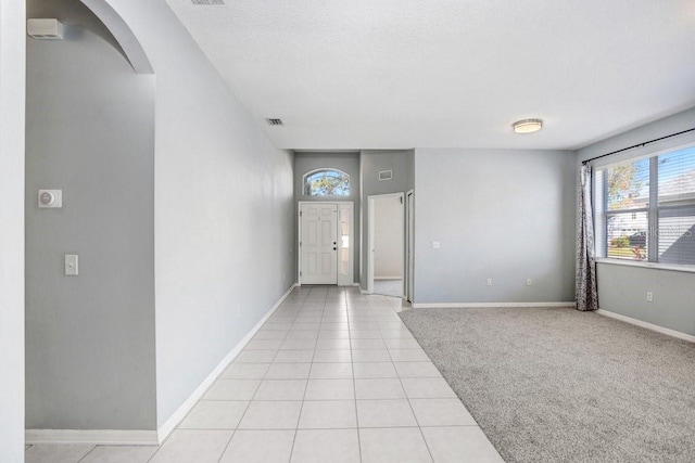 entryway featuring light tile patterned flooring