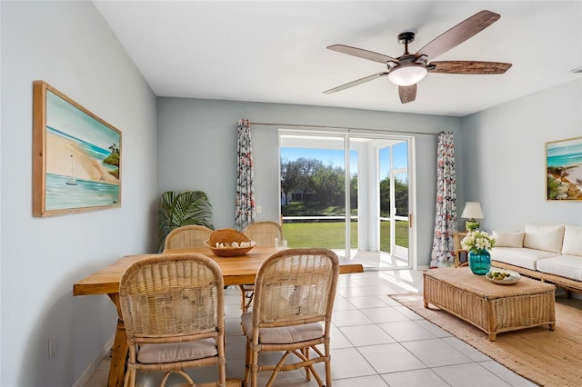 dining space featuring ceiling fan and light tile patterned flooring