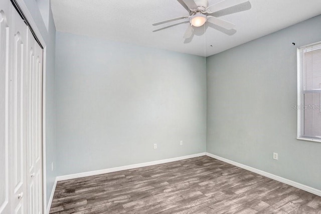 spare room with ceiling fan and hardwood / wood-style floors