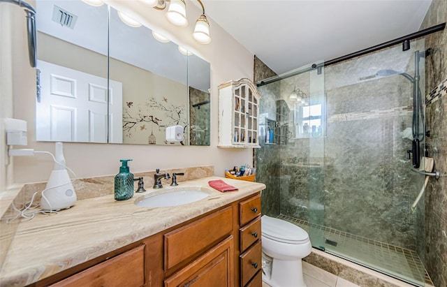 bathroom featuring a stall shower, visible vents, toilet, tile patterned flooring, and vanity