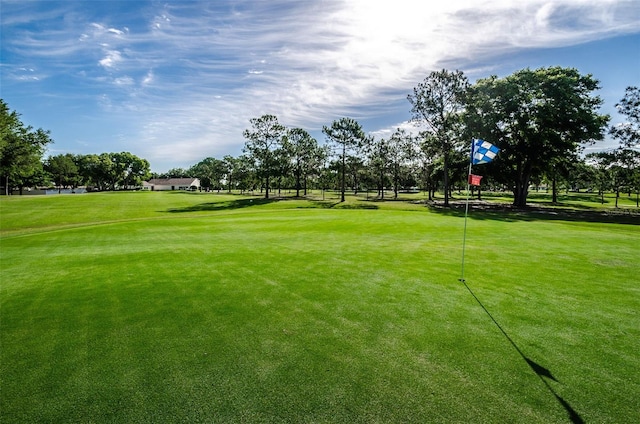 surrounding community featuring view of golf course