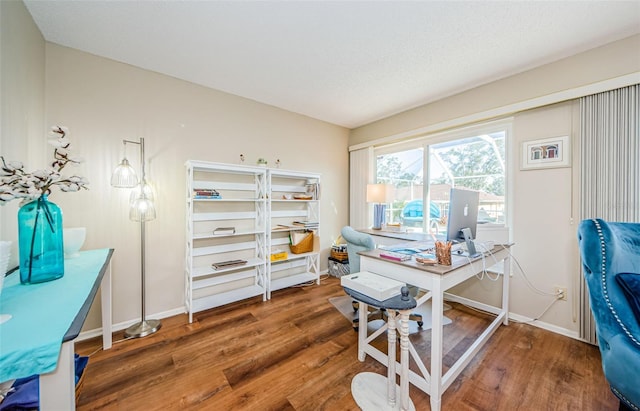 office featuring dark wood-type flooring and baseboards