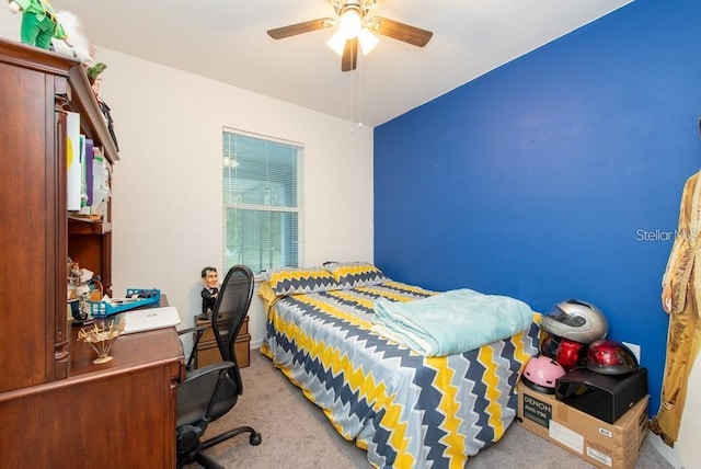 bedroom featuring light colored carpet and ceiling fan