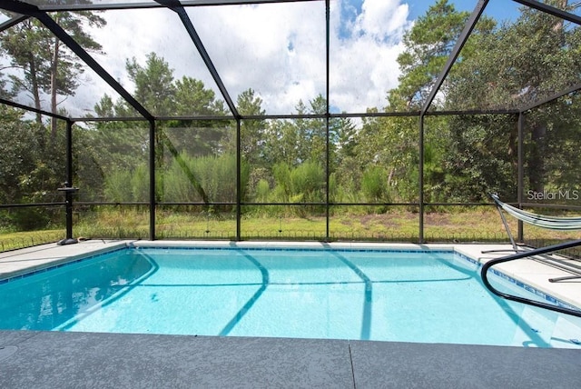 view of pool with a lanai