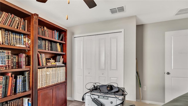 interior space featuring ceiling fan