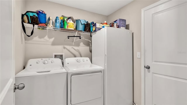 washroom featuring independent washer and dryer