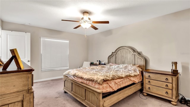 bedroom with ceiling fan and carpet floors