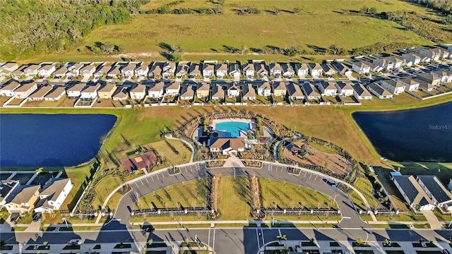 bird's eye view with a water view