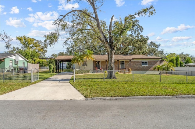 single story home with a front yard and a carport