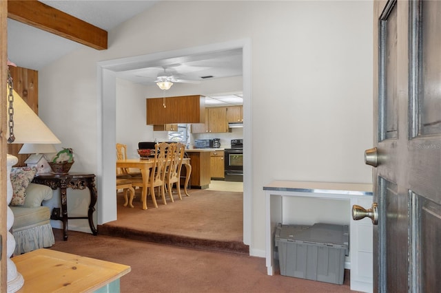 interior space featuring vaulted ceiling with beams, ceiling fan, and light colored carpet