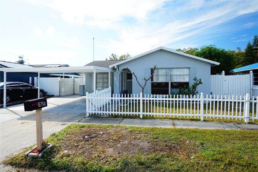 view of front of property with a carport