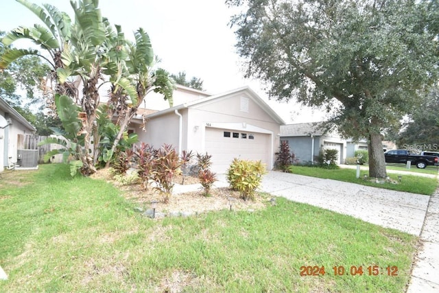 504 Maple Pointe Dr, Seffner, FL 33584 - view of front of property featuring stucco siding, central air condition unit, concrete driveway, and a front yard