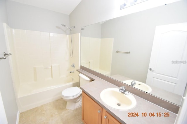 full bathroom featuring toilet, tile patterned floors, vanity, and bathing tub / shower combination