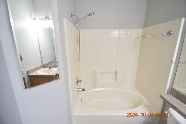 bathroom with vanity and  shower combination