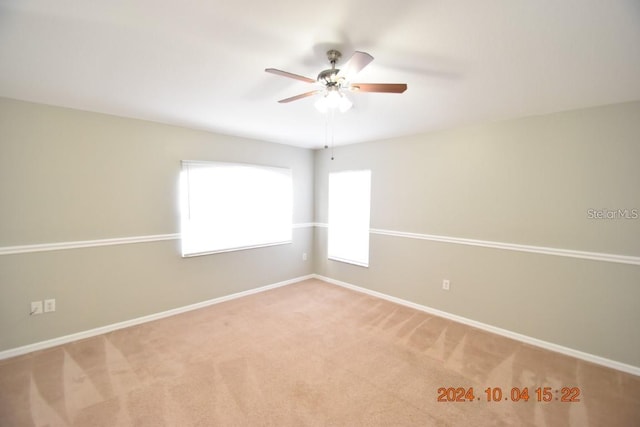 carpeted empty room with ceiling fan