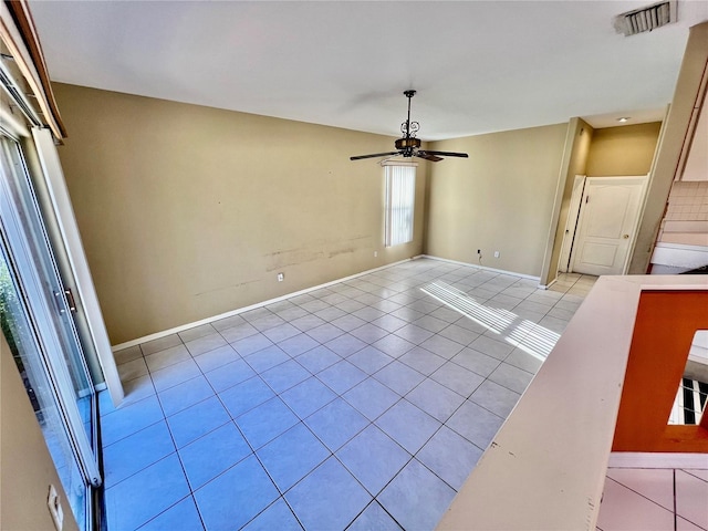 unfurnished room featuring ceiling fan and light tile patterned floors