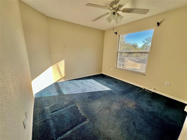 carpeted empty room featuring ceiling fan